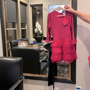 Girls fushia sequence top with ruffles at bottom; and black leggings.